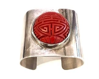 4s6e. Sterling and carved cinnebar cuff
