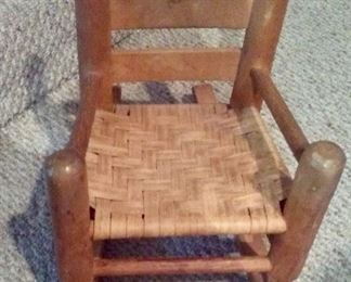 Circa 1860s doll’s rocker with paper seat