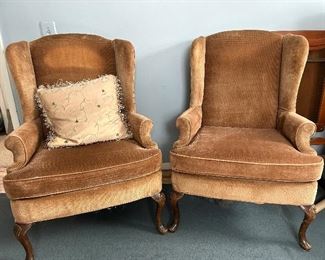 pair of upholstered wing back chairs