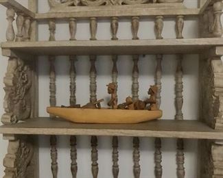carved shelf with treasures