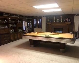 1940-50's Brunswick Centennial Pool Table. This Table is in good condition but it needs to have the wood refinished, new pockets and the aluminum needs to be polished to a shiny finish.