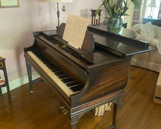 Baby grand piano over 100 years old
