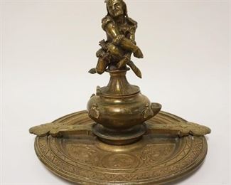 1002	ANTIQUE ORNATE BRASS INKWELL W/FIGURE OF A COURT JESTER ON TOP OF HINGED LID, INKWELL REVOLVES ON BASE 360 DEGREES, APPROXIMATELY 10 IN X 8 IN HIGH
