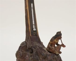 1032	WOOD CARVED AMERICAN NATIVE SMOKING A PIPE AT BASE OF TREE W/THERMOMETER, APPROXIMATELY 7 IN HIGH
