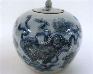 1038	ASIAN JAR W/FOO DOG DECORATIONS W/LID, APPROXIMATELY 7 IN HIGH
