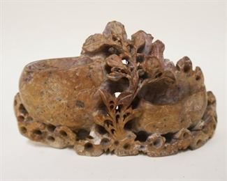 1051	SOAPSTONE CARVING OF FLOWERS & OVAL SHAPED HOLDERS, APPROXIMATELY 7 1/2 IN X 4 1/4 IN HIGH
