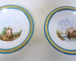 1060	HAND PAINTED COMPOTES W/BLUE & GILT DECORATED BORDER, SCENES OF LANDSCAPES W/STRUCTURES AT WATERS EDGE, APPROXIMATELY 9 1/4 IN X 2 1/4 IN HIGH
