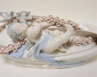 1091	GERMAN PORCELAIN OVAL PLANTER W/RAISED CHERUB W/DOVES & FLOWERS ON A VINE, APPROXIMATELY 12 IN X 7 IN X 4 1/2 IN HIGH

