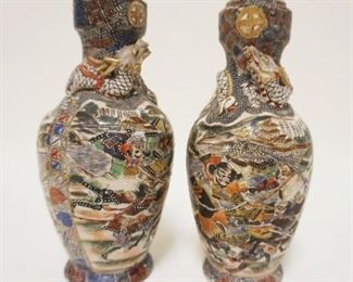 1094	PAIR OF ASIAN POTTERY VASES W/WARRIORS & RELIEF DRAGON WRAPPED AROUND NECK OF VASES, APPROXIMATELY 7 1/2 IN
