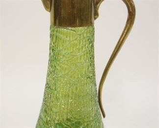 1105	ART GLASS GREEN IRIDESCENT PITCHER W/HINGED LID, METAL COLLAR AND HANDLE, APPROXIMATELY 11 1/2 IN HIGH
