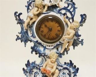 1140	ORNATE DELFT CLOCK W/RETICULATED EDGE TOP & FIGURES OF AN ANGEL & CHERUBS, APPROXIMATELY 20 IN HIGH
