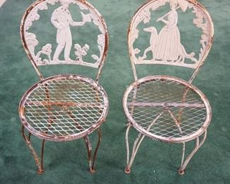 1162	PAIR OF METAL GARDEN CHAIRS W/CAST METAL COURTING SCENES

