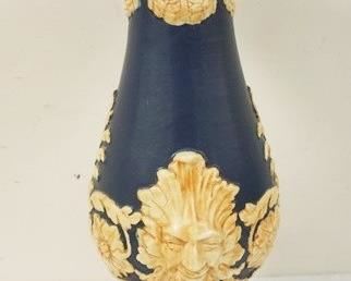 1195	ART POTTERY PEDESTAL WITH EMBOSSED FLOWERS AND FACES, APPROXIMATELY 21 IN H
