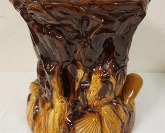 1197	POTTERY STAND/PEDESTAL WITH EMBOSSED SEA SHELLS AROUND BASE, MARKED ENGLAND, APPROXIMATELY 11 1/2 IN X 13 1/2 IN H
