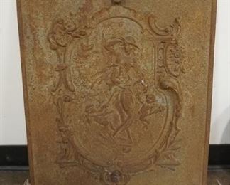 1200	CAST IRON COVER WITH EMBOSSED DESIGN OF WOMAN AND CHERUBS, APPROXIMATELY 20 IN X 26 IN
