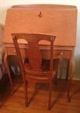 Drop-front desk and chair.