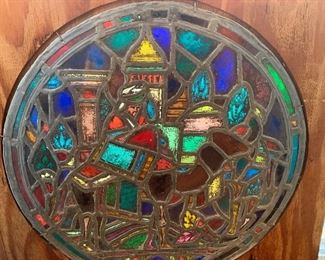 early  stain glass window rescued  from  an  old  Lafayette home. The stained glass features a Wise Man on camelback featured in the Nativity  story. 
