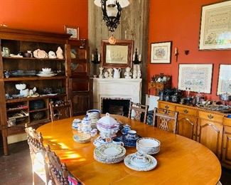 maple very long  kitchen table and can you see Mr Girouard’s whimsical sculptures in the pie safe?