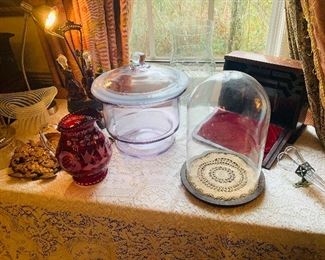 authentic OLD glass  display domes (cloches) , early writing  boxes (traveling desks), Victorian Ruby Red cruet set, Ruby  pitcher and do you see all the way to the right--the bud vase and mount for a 1920's luxury car--Mr. G had everything!