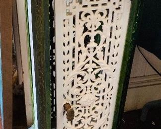 Green and white wrought iron heater stand