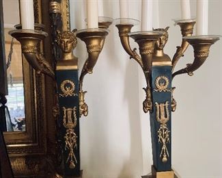 French Empire patinated and gilded bronze candelabras. 