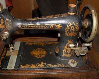 Antique Minnesota A treadle sewing machine in nice oak cabinet with five drawers