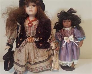 2 dolls on stand
