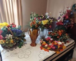 faux flowers in vases and basket