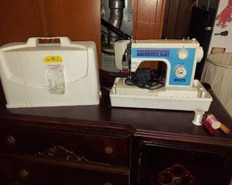 White sewing machine in case