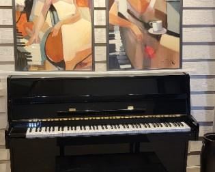 Kawai console piano with high polish polyester finish