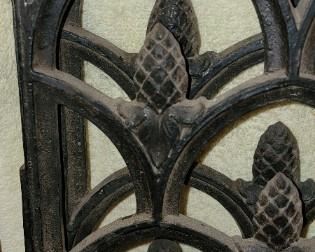 Close-up of design on vintage HEAVY iron gates