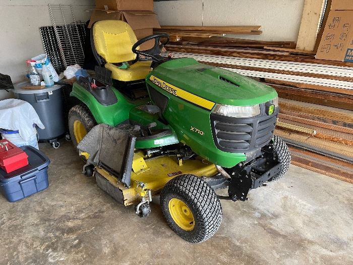 John Deere Tractor 710X 60” cut, Kawasaki motor, 375 hours of operation, $8000.