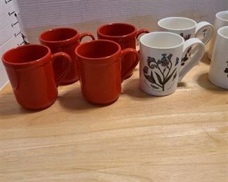 Four poppy red Lenox Kate Spade mugs and four botanic garden mugs