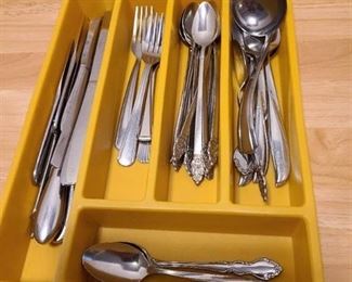 Assorted cutlery in plastic tray