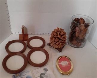 Picture frames, note holder, Pinecone candle, and vase of pinecones