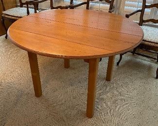 (F1) Very sturdy solid wood table. 47.5" round with leaf that adds 24". Floor to table top is 30". Asking $150. 