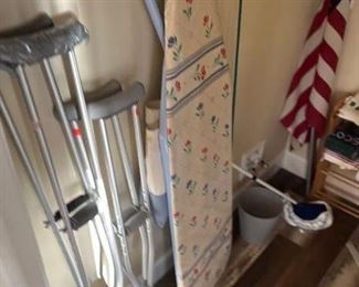Folding ironing table and crutches