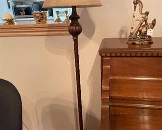 Floor lamp with figurine