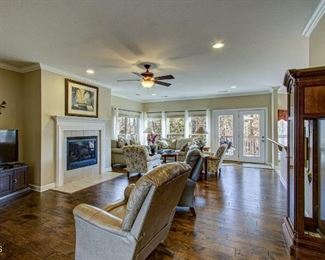 TV, TV stand, two leather recliners.  One is Lazyboy.  Grandfather clock by Howard Miller.