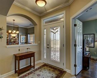 Matching foyer rug and small foyer table.
