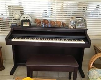 "ROLAND" KR5 Intelligent Digital Piano and Bench.          Plays really well.  Have original manual and discs too.