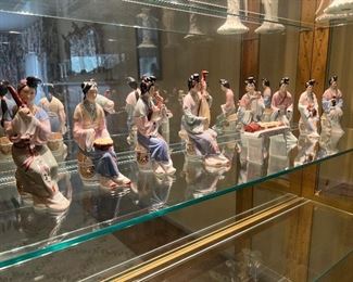 Pre-1910 porcelain Giesha's with instruments (9 pc)