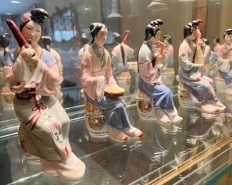 Pre-1910 porcelain Giesha's with instruments (9 pc)