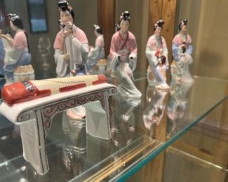 Pre-1910 porcelain Giesha's with instruments (9 pc)