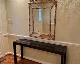 Gold Baroque accent wall mirror with black console table