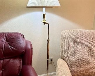 1970s brass adjustable height floor lamp. Swing arm, footed base.