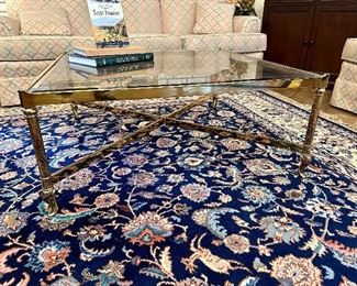 Exceptional Mid Century smoky beveled glass and brass cocktail table. Check it out on 1stDibs!