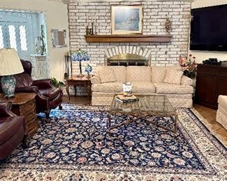 Custom upholstered sofa and loveseat. Reclining leather chairs with nail-head trim, Drexel Heritage side tables, Mid Century Brass and Glass Cocktail Table, and 60" Pioneer KURO Flat Panel TV. PDP-6020FD.