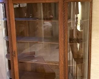 Vintage curved glass curio cabinet with four shelves