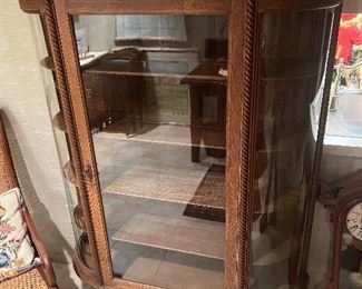 Curved glass curio cabinet